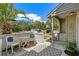 Outdoor patio furnished with a table, chairs, and an umbrella offering a cozy space for relaxation and entertaining at 55 Shadow Moss Pl. # 55, North Myrtle Beach, SC 29582