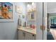 Quaint powder room with beach-themed decor, white vanity, and a charming mirror above the sink at 55 Shadow Moss Pl. # 55, North Myrtle Beach, SC 29582