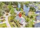 Aerial view of a lakeside property with lush landscaping and a private driveway at 552 Enoree Ct., Myrtle Beach, SC 29588