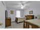 Cozy bedroom with twin beds, ceiling fan, and neutral decor, creating a relaxing atmosphere at 552 Enoree Ct., Myrtle Beach, SC 29588