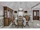 Well-lit dining room with neutral carpet, wooden table with seating for six, and a hutch at 552 Enoree Ct., Myrtle Beach, SC 29588