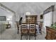Traditional dining room features wallpaper, a large wooden hutch and seating for eight at 552 Enoree Ct., Myrtle Beach, SC 29588