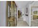 Entryway with display cabinet offers a glimpse into the spacious living area with fireplace at 552 Enoree Ct., Myrtle Beach, SC 29588