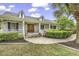 Charming home features a brick facade, inviting porch, and beautifully landscaped front yard at 552 Enoree Ct., Myrtle Beach, SC 29588