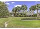 Traditional home featuring a welcoming front porch, manicured landscaping, and a brick facade at 552 Enoree Ct., Myrtle Beach, SC 29588