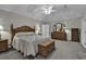 Spacious main bedroom has neutral walls and carpet, plenty of furniture and is well-lit at 552 Enoree Ct., Myrtle Beach, SC 29588