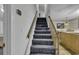 Carpeted staircase leads to upper levels, enhancing accessibility to living spaces and upstairs bedrooms at 552 Enoree Ct., Myrtle Beach, SC 29588