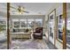 Bright and airy sunroom with comfortable seating and expansive views of the surrounding landscape at 552 Enoree Ct., Myrtle Beach, SC 29588