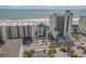 Stunning aerial view of a beachfront property nestled between high-rise buildings, offering captivating ocean vistas at 5751 Oyster Catcher Dr. # 334, North Myrtle Beach, SC 29582