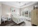 Cozy bedroom with tray ceilings, stylish furnishings, and lots of natural light at 5751 Oyster Catcher Dr. # 334, North Myrtle Beach, SC 29582