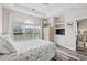 This bedroom has a ceiling fan, natural light, decorative accents, and an ensuite bathroom at 5751 Oyster Catcher Dr. # 334, North Myrtle Beach, SC 29582