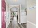 Inviting foyer with wood-look flooring, coat closet and a 'Welcome' sign for a warm and friendly entrance at 5751 Oyster Catcher Dr. # 334, North Myrtle Beach, SC 29582