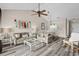 Cozy living room with comfortable seating, wood floors, stylish decor, and an open flow to the adjacent dining area at 5751 Oyster Catcher Dr. # 334, North Myrtle Beach, SC 29582