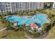 Expansive swimming pool with lush landscaping, offering a resort-like atmosphere for relaxation and enjoyment at 5751 Oyster Catcher Dr. # 334, North Myrtle Beach, SC 29582