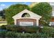 Welcoming brick sign for Wedgewood, nestled among lush greenery, creates an inviting entrance to the community at 5751 Oyster Catcher Dr. # 334, North Myrtle Beach, SC 29582