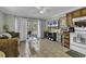 Inviting living area with tiled floors, a ceiling fan, a view to the outside, and a well-equipped kitchenette at 5905 South Kings Hwy. # 135, Myrtle Beach, SC 29575