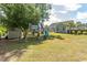 Backyard with playground, storage shed, and view of the home at 601 Blue Daisy Ct., Loris, SC 29569
