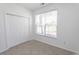 Bedroom with carpet, closet and bright window at 601 Blue Daisy Ct., Loris, SC 29569
