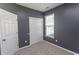 Cozy bedroom with a large closet, window, and neutral carpet awaiting personal touches at 601 Blue Daisy Ct., Loris, SC 29569
