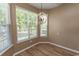 Bright breakfast nook features large windows providing ample natural light and modern chandelier at 601 Blue Daisy Ct., Loris, SC 29569