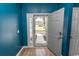 Blue entryway with wood floors and a door leading outside at 601 Blue Daisy Ct., Loris, SC 29569