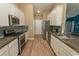Well-appointed kitchen featuring stainless steel appliances, wood countertops, and white cabinets at 601 Blue Daisy Ct., Loris, SC 29569