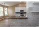 The kitchen showcases white cabinetry, wood countertops, a breakfast bar, and stainless steel appliances at 601 Blue Daisy Ct., Loris, SC 29569