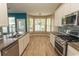 Bright kitchen with stainless appliances, modern countertops, and a charming breakfast nook bathed in natural light at 601 Blue Daisy Ct., Loris, SC 29569
