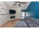 Comfortable living room featuring a modern fireplace, mounted TV, and stylish decor at 601 Blue Daisy Ct., Loris, SC 29569