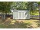 Backyard storage shed with double doors and dark roof at 601 Blue Daisy Ct., Loris, SC 29569