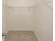 A tidy empty walk-in closet with wire shelving and neutral carpet ready for organizing at 601 Blue Daisy Ct., Loris, SC 29569