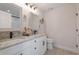 Bathroom with a double sink vanity, granite countertop, modern fixtures, and neutral color palette at 6095 Catalina Dr. # 1613, North Myrtle Beach, SC 29582