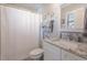 Bathroom featuring a shower with curtain, vanity with granite top, and decorative coastal accents at 6095 Catalina Dr. # 1613, North Myrtle Beach, SC 29582