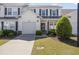 Charming two-story home with a well-manicured lawn, attached garage, and complementary landscaping at 6095 Catalina Dr. # 1613, North Myrtle Beach, SC 29582