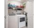 Efficient laundry room featuring modern appliances, storage shelves, and ample space at 6095 Catalina Dr. # 1613, North Myrtle Beach, SC 29582