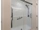 Modern walk-in shower featuring white subway tile, a frameless glass enclosure, and a rainfall shower head at 6095 Catalina Dr. # 1613, North Myrtle Beach, SC 29582