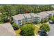 Aerial view of the condo complex nestled among lush landscaping, trees, and a well-maintained exterior at 6253 Catalina Dr. # 422, North Myrtle Beach, SC 29582