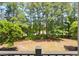 Picturesque view of a lush green backyard with mature trees, creating a serene and private setting at 6253 Catalina Dr. # 422, North Myrtle Beach, SC 29582
