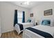 Shared bedroom featuring two twin beds with nautical decor and a bright window at 6253 Catalina Dr. # 422, North Myrtle Beach, SC 29582