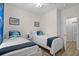 Bright bedroom with two twin beds, coastal-themed decor, and natural light at 6253 Catalina Dr. # 422, North Myrtle Beach, SC 29582