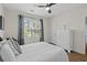 Comfortable bedroom with a large window, white dresser, and tasteful decorations at 6253 Catalina Dr. # 422, North Myrtle Beach, SC 29582
