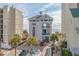 A three-story building with balconies faces the beach, located between two taller condo buildings at 6253 Catalina Dr. # 422, North Myrtle Beach, SC 29582
