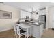 Bright kitchen featuring granite countertops, white cabinets, and stainless steel appliances at 6253 Catalina Dr. # 422, North Myrtle Beach, SC 29582