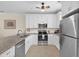 Bright kitchen with stainless steel appliances, granite countertops, and ample white cabinetry at 6253 Catalina Dr. # 422, North Myrtle Beach, SC 29582