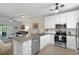 Open kitchen featuring stainless steel appliances, granite countertops, and white cabinetry at 6253 Catalina Dr. # 422, North Myrtle Beach, SC 29582