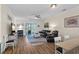 Cozy living room with wood floors, ceiling fan, balcony access, and comfortable seating at 6253 Catalina Dr. # 422, North Myrtle Beach, SC 29582