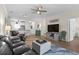 Spacious living room open to the kitchen features hardwood floors and stylish furnishings at 6253 Catalina Dr. # 422, North Myrtle Beach, SC 29582