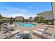 Beautiful pool area with comfortable lounge chairs, tables, and a tranquil view of the surrounding landscape at 6253 Catalina Dr. # 422, North Myrtle Beach, SC 29582