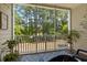 Relaxing screened porch featuring a view of a lush, wooded area and comfortable seating at 6253 Catalina Dr. # 422, North Myrtle Beach, SC 29582