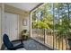 Cozy screened porch featuring a lovely view of a wooded landscape and a comfortable seating area at 6253 Catalina Dr. # 422, North Myrtle Beach, SC 29582